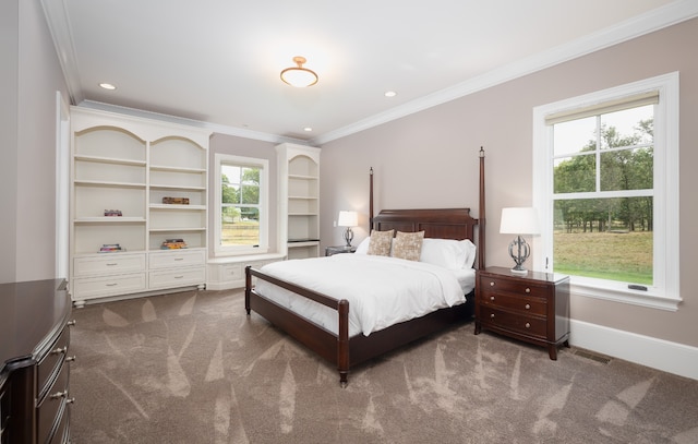 bedroom featuring ornamental molding and carpet