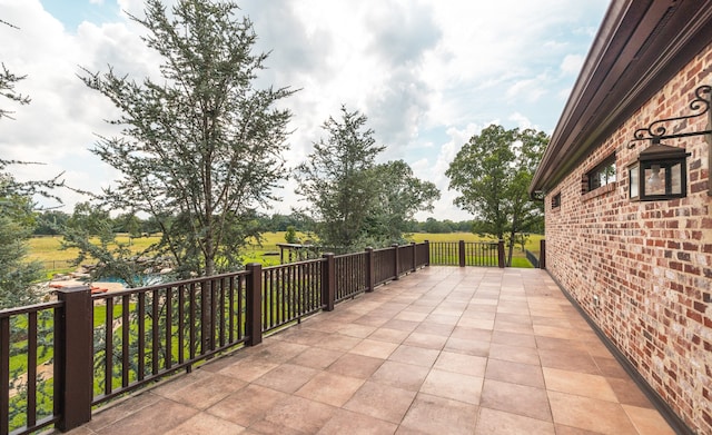 view of patio with a balcony