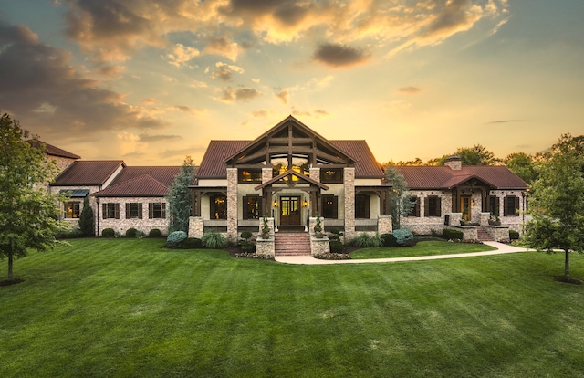 view of front of property with a lawn