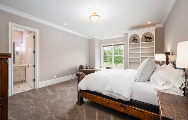 carpeted bedroom with crown molding and ensuite bathroom