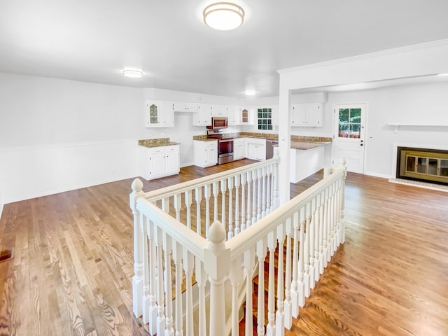 corridor featuring hardwood / wood-style floors