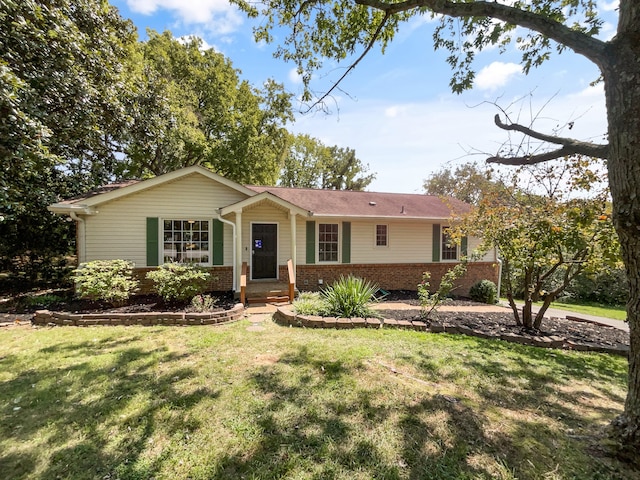 single story home featuring a front lawn