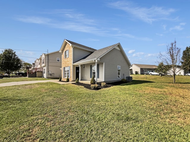 view of home's exterior featuring a lawn and central AC unit