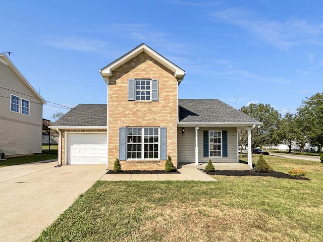 view of front property featuring a garage and a front yard