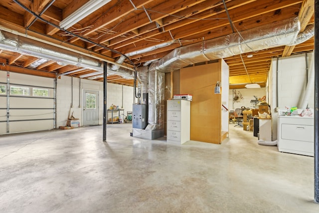 garage with heating unit and washer / dryer