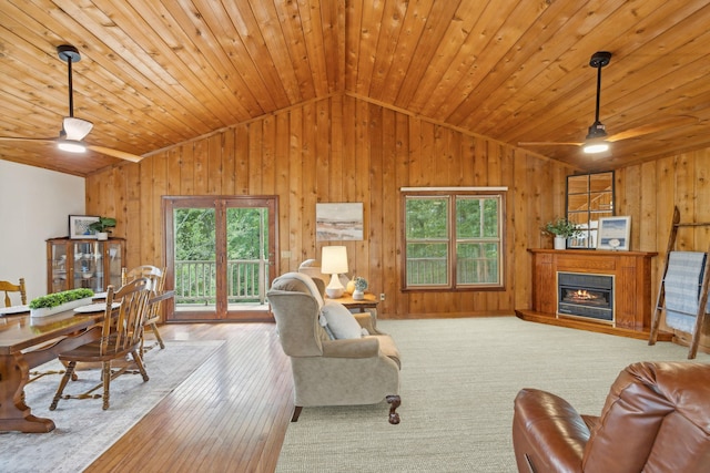 living room with light hardwood / wood-style floors, ceiling fan, and plenty of natural light