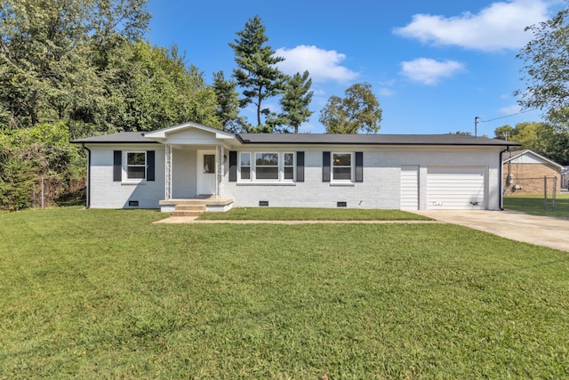 ranch-style home with a garage and a front yard