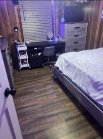 bedroom featuring dark hardwood / wood-style floors