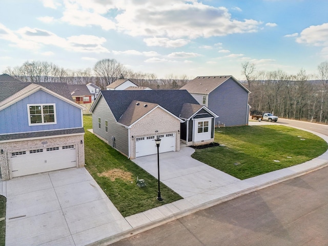 view of front of property featuring a garage and a front lawn