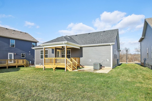 rear view of house featuring ceiling fan, a patio area, a yard, central AC unit, and a deck