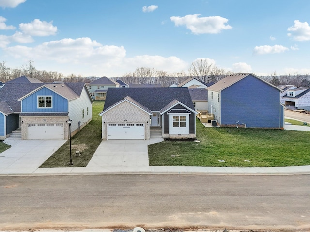 view of front of property featuring a front yard and a garage