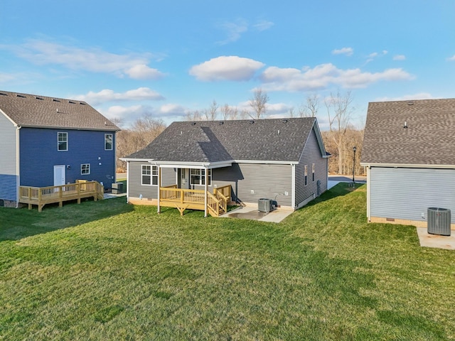 rear view of property featuring a deck, central AC, a yard, and a patio