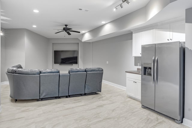 living room featuring ceiling fan