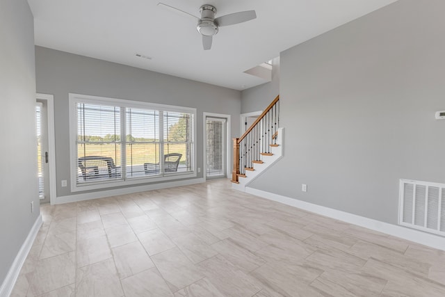 unfurnished room with ceiling fan