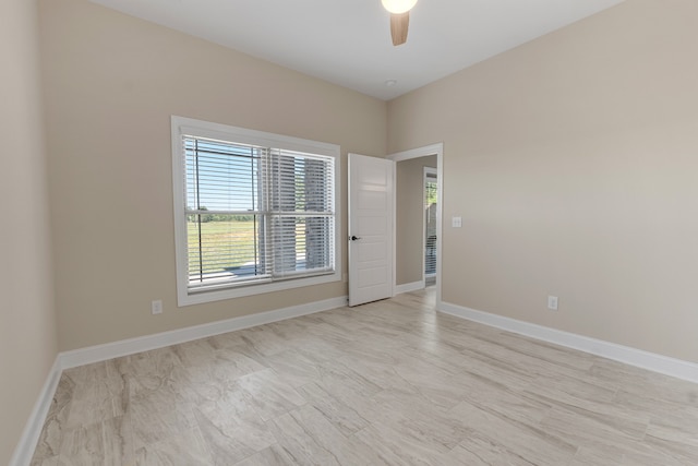 spare room with ceiling fan