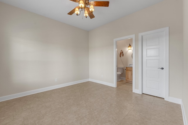 unfurnished bedroom with ensuite bathroom, ceiling fan, and light tile patterned floors