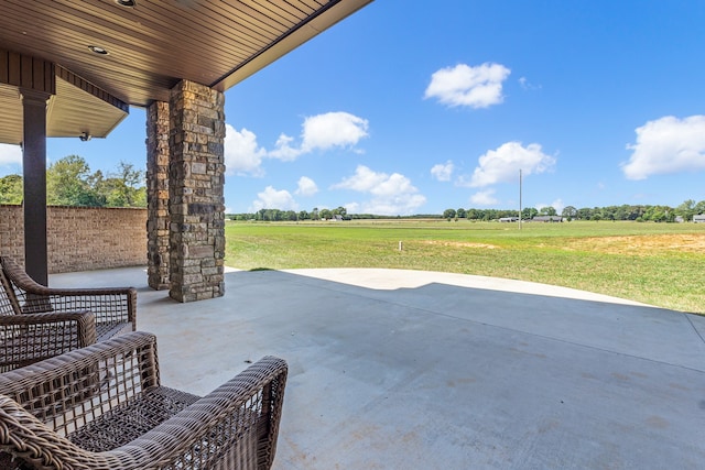 view of patio with a rural view