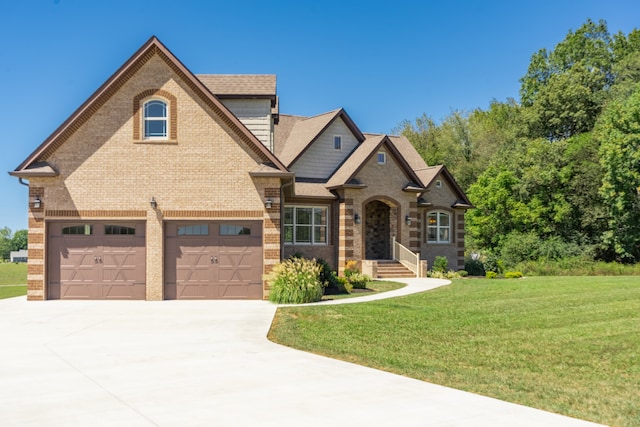 craftsman house with a front yard and a garage