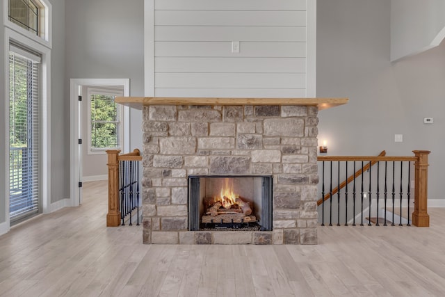 interior details with a fireplace and hardwood / wood-style floors