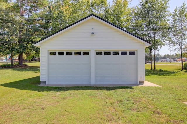 garage with a lawn