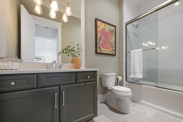 full bathroom with tile patterned floors, shower / bath combination with glass door, toilet, and vanity