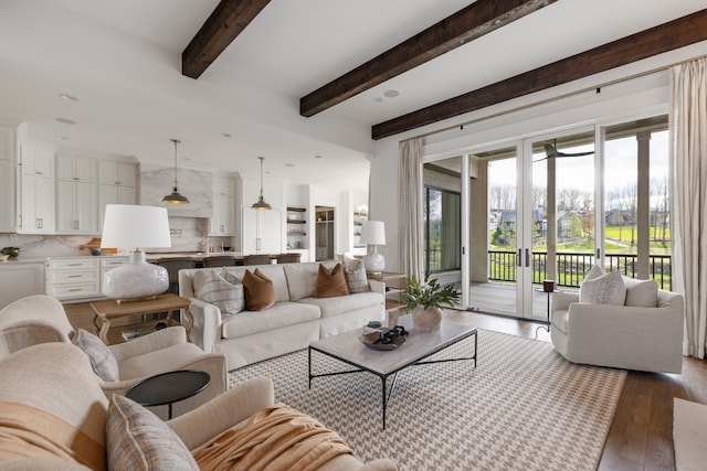 living room with wood-type flooring and beam ceiling