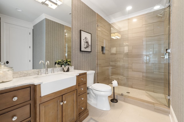 bathroom with toilet, an enclosed shower, tile patterned floors, ornamental molding, and vanity