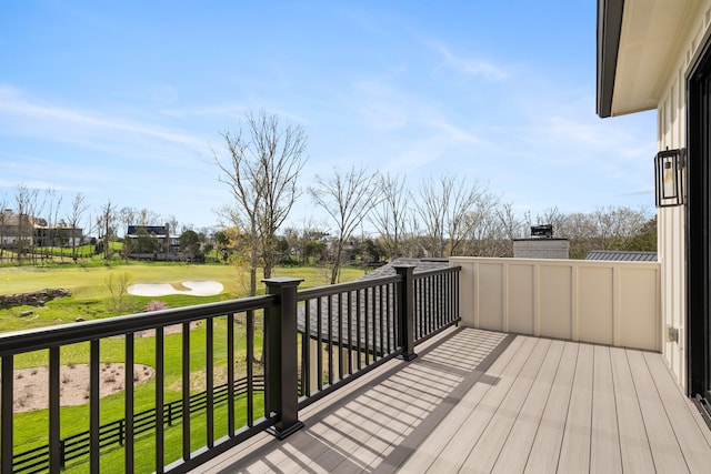 wooden terrace with a yard