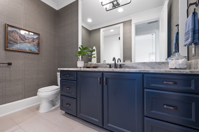 bathroom with ornamental molding, vanity, toilet, and tile patterned floors