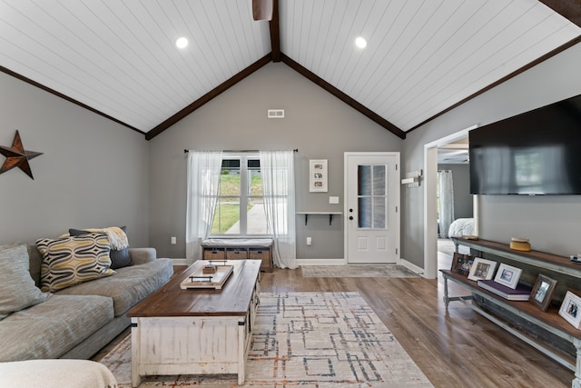 living room featuring wooden ceiling, hardwood / wood-style flooring, and lofted ceiling with beams