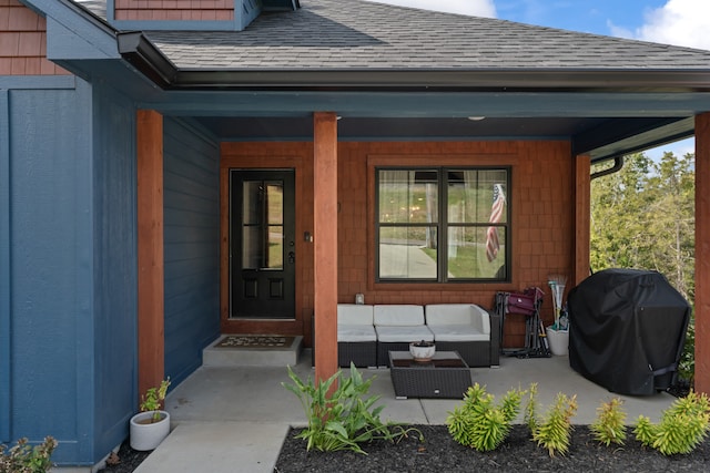 entrance to property with an outdoor hangout area and a porch