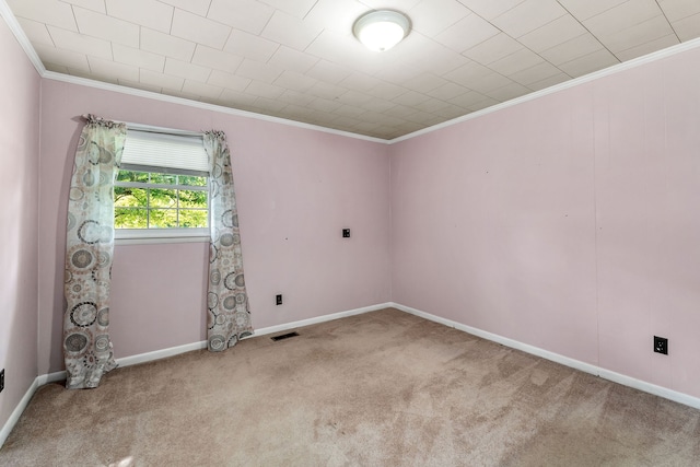 carpeted spare room featuring crown molding