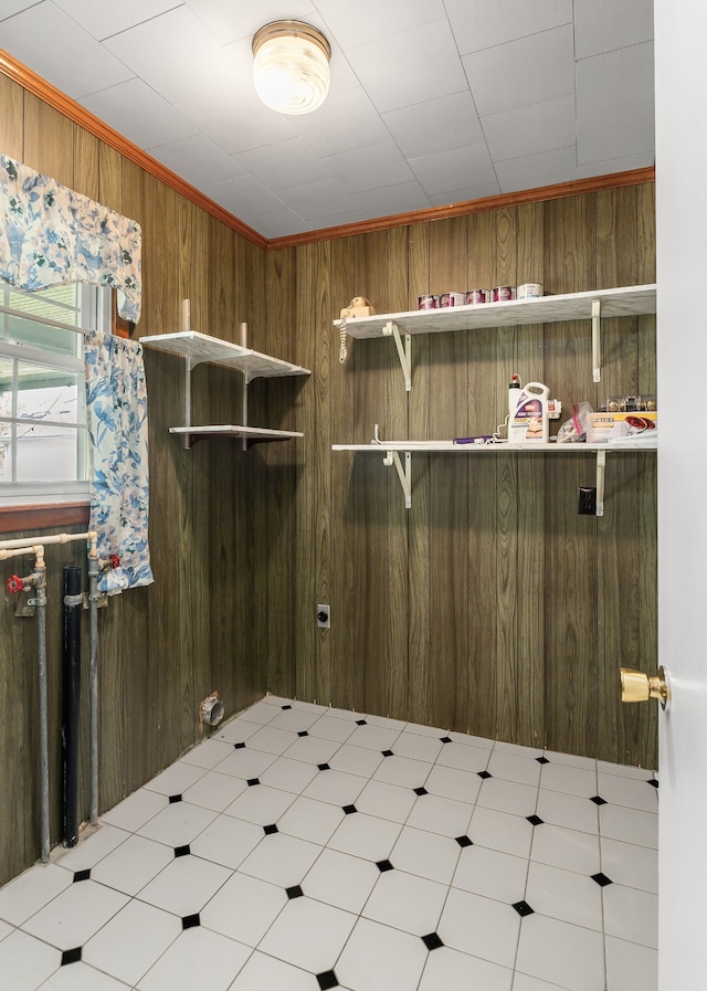 laundry area featuring wooden walls