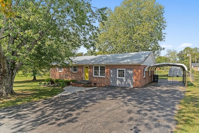 ranch-style home with a carport and a front lawn