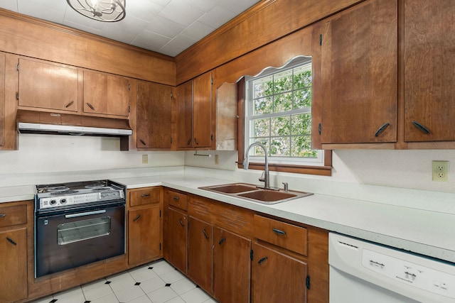 kitchen featuring black / electric stove, white dishwasher, and sink