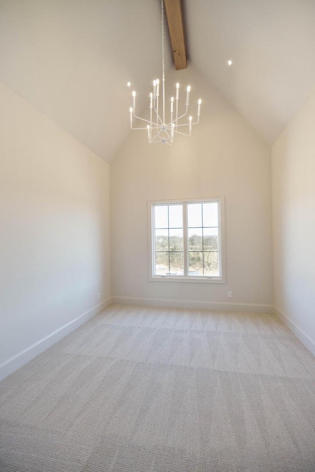 spare room with baseboards, a chandelier, beamed ceiling, light carpet, and high vaulted ceiling