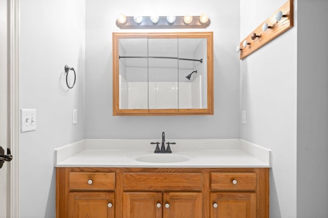 full bath with vanity and walk in shower