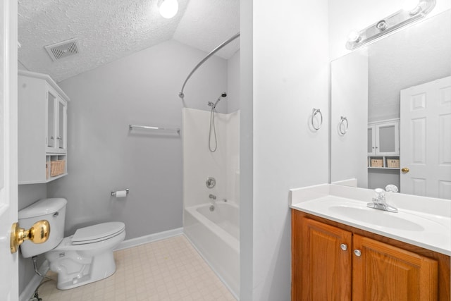 bathroom with visible vents, vanity, toilet, a textured ceiling, and vaulted ceiling