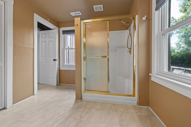 bathroom with an enclosed shower