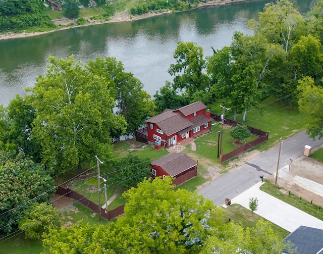 birds eye view of property with a water view