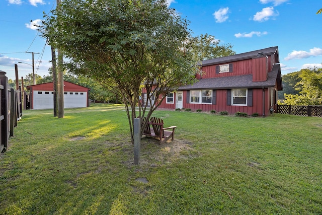 view of yard with an outbuilding and a garage