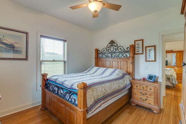 bedroom featuring light hardwood / wood-style flooring and ceiling fan