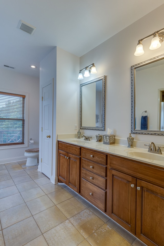 bathroom with tile patterned floors, toilet, and vanity