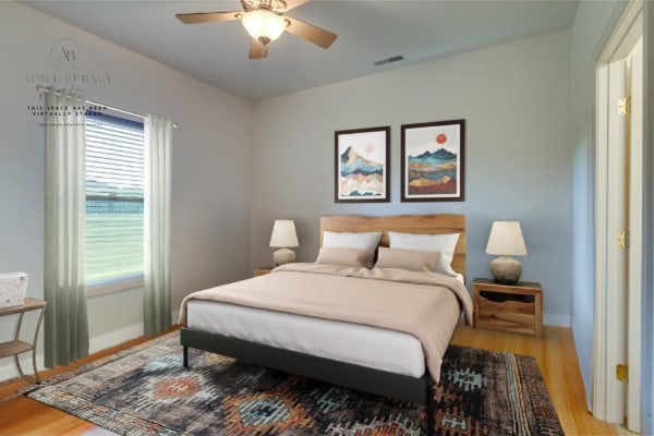 bedroom with ceiling fan and hardwood / wood-style flooring