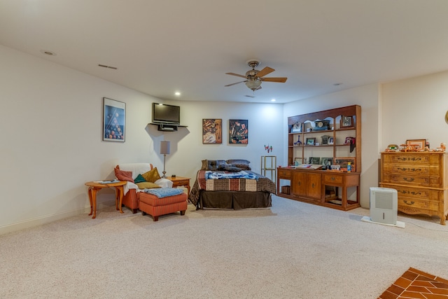 interior space featuring carpet flooring and ceiling fan