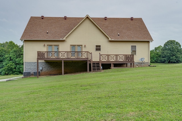 back of property featuring a yard, central AC unit, and a deck