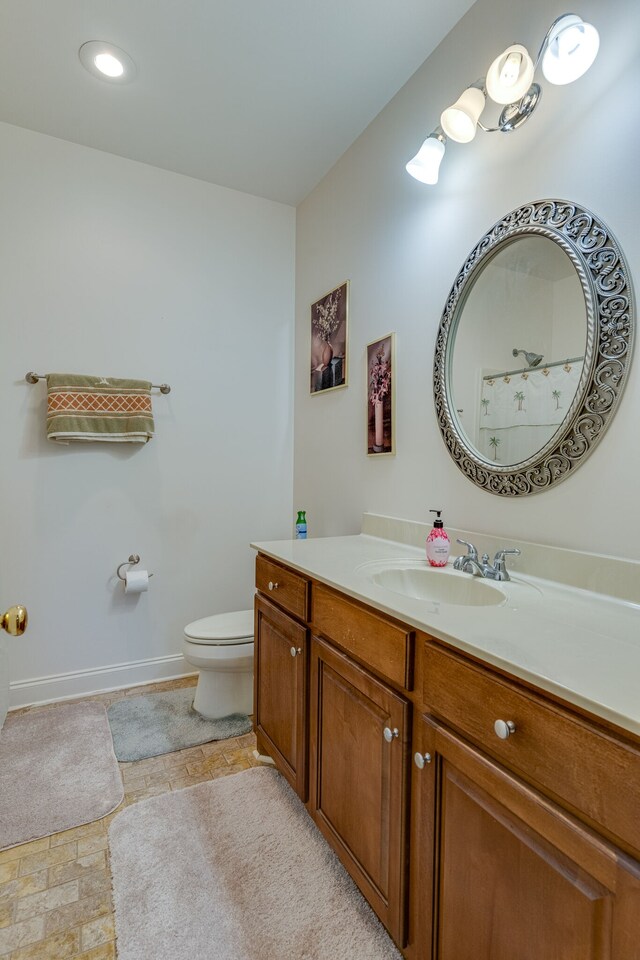 bathroom with vanity and toilet