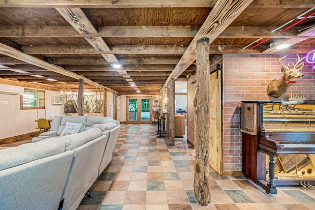 basement featuring wooden ceiling, a wall mounted air conditioner, and brick wall