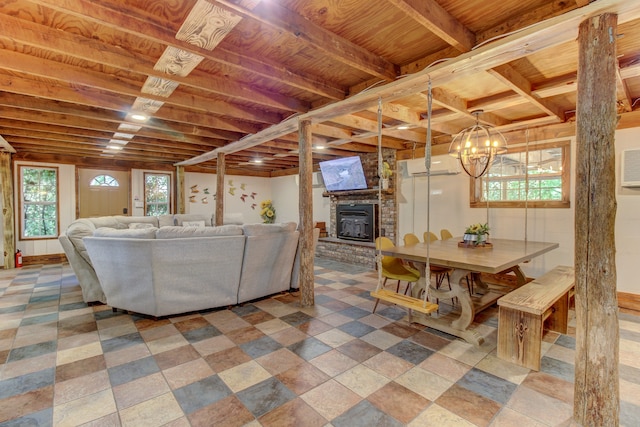 dining area featuring plenty of natural light, an AC wall unit, and a brick fireplace