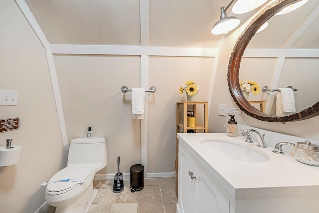 bathroom featuring vanity, toilet, and tile patterned floors